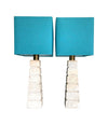 Mid Century table lamps with Travertine bases and brass fittings with blue linen shades - Mid Century Lighting