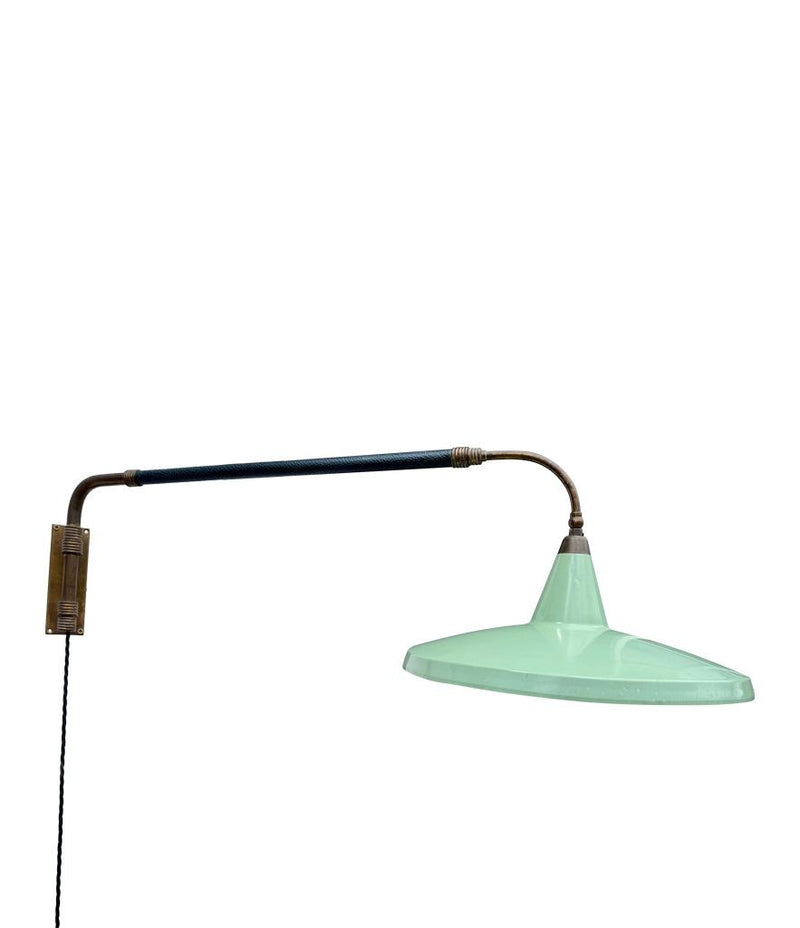 An Italian 1950s Stilnovo brass extendable telescopic wall light with green stitched leather arm