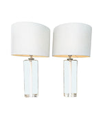 A pair of 1960s Orrefors heavy glass lamps with white glass core and nickel fittings
