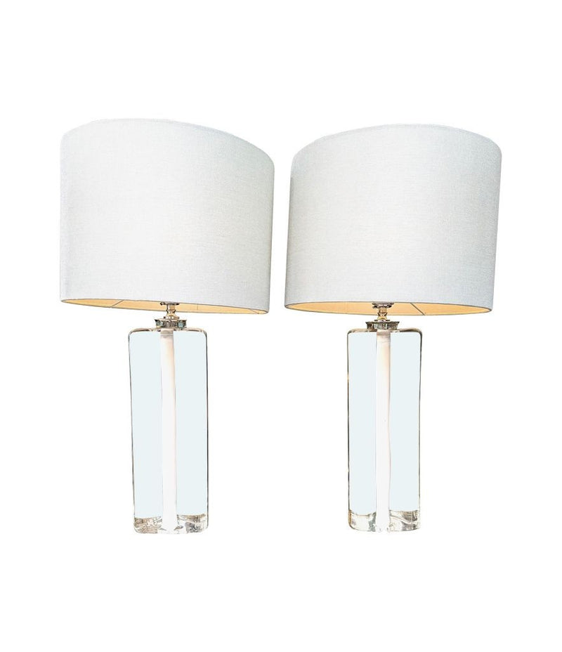 A pair of 1960s Orrefors heavy glass lamps with white glass core and nickel fittings