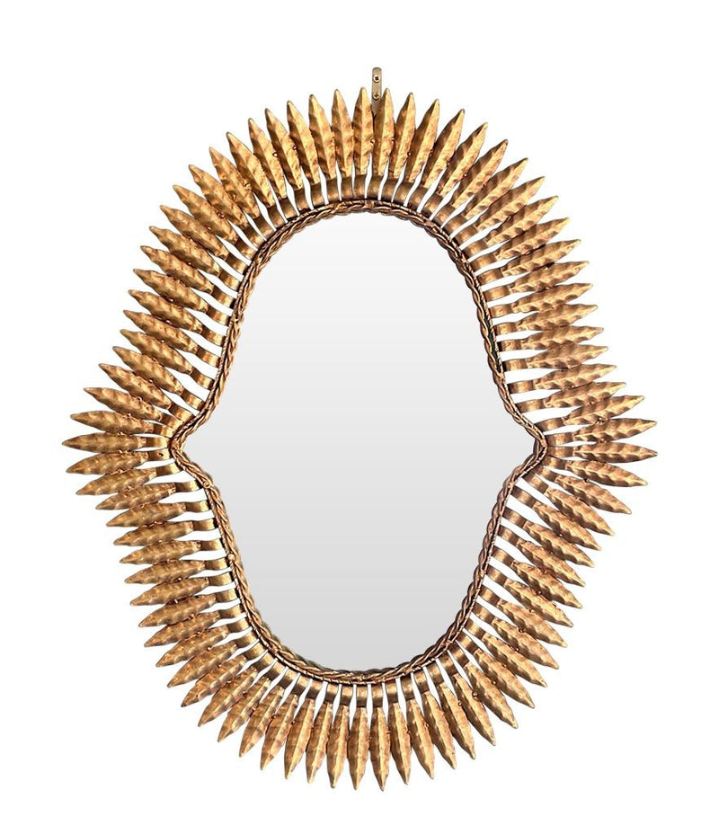 An interesting shaped 1950s Spanish gilt metal sunburst mirror