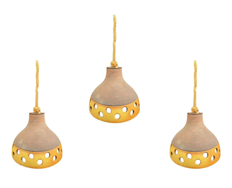 A set of three 1960s French glazed ceramic ceiling lights suspended from thick knotted rope