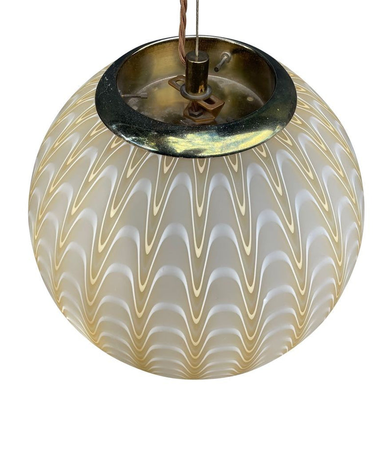 A 1960s Murano glass pendant light attributed to Venini with yellow and white swirl patten