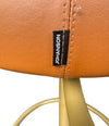 A set of four Börje Johanson “Jupiter” bar stools in cognac faux leather