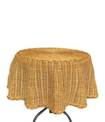 An Italian 1970s woven rattan "draped" side table with cost iron legs