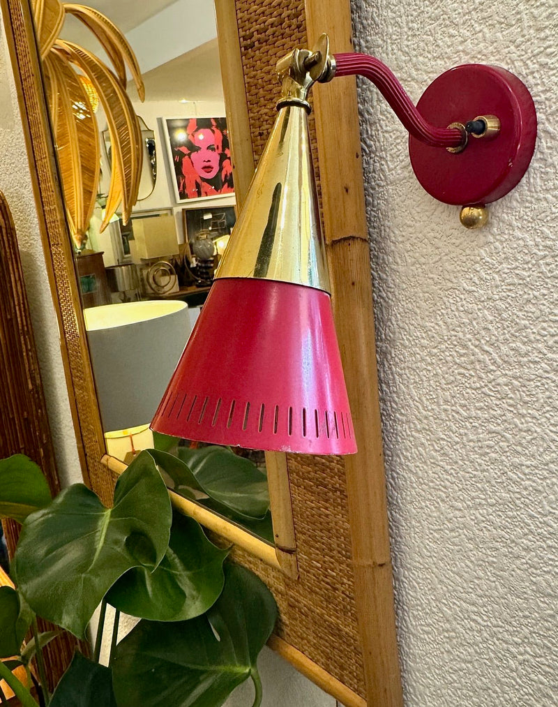 A pair of Holm Sorensen 1950s red enamelled metal and brass adjustable wall lights