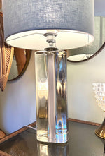 A pair of 1960s Orrefors heavy glass lamps with white glass core and nickel fittings