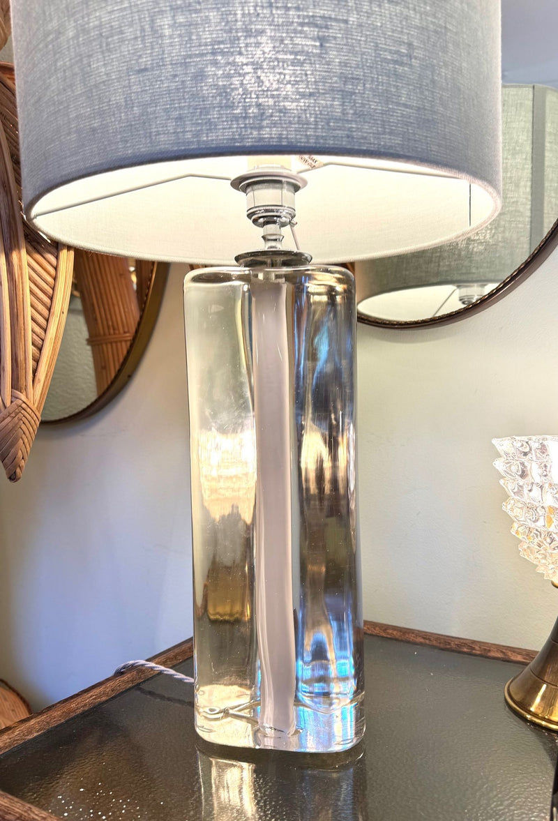 A pair of 1960s Orrefors heavy glass lamps with white glass core and nickel fittings