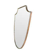 An orignal Italian 1960s brass shield mirror with beaded inner frame detail