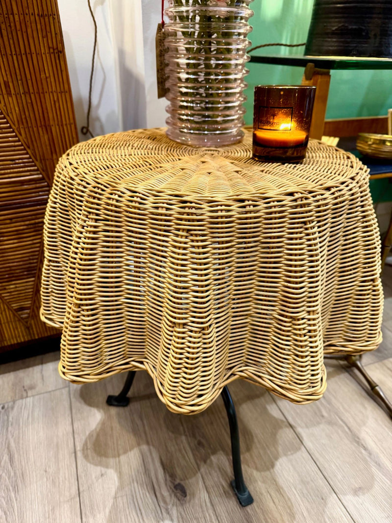 An Italian 1970s woven rattan "draped" side table with cost iron legs