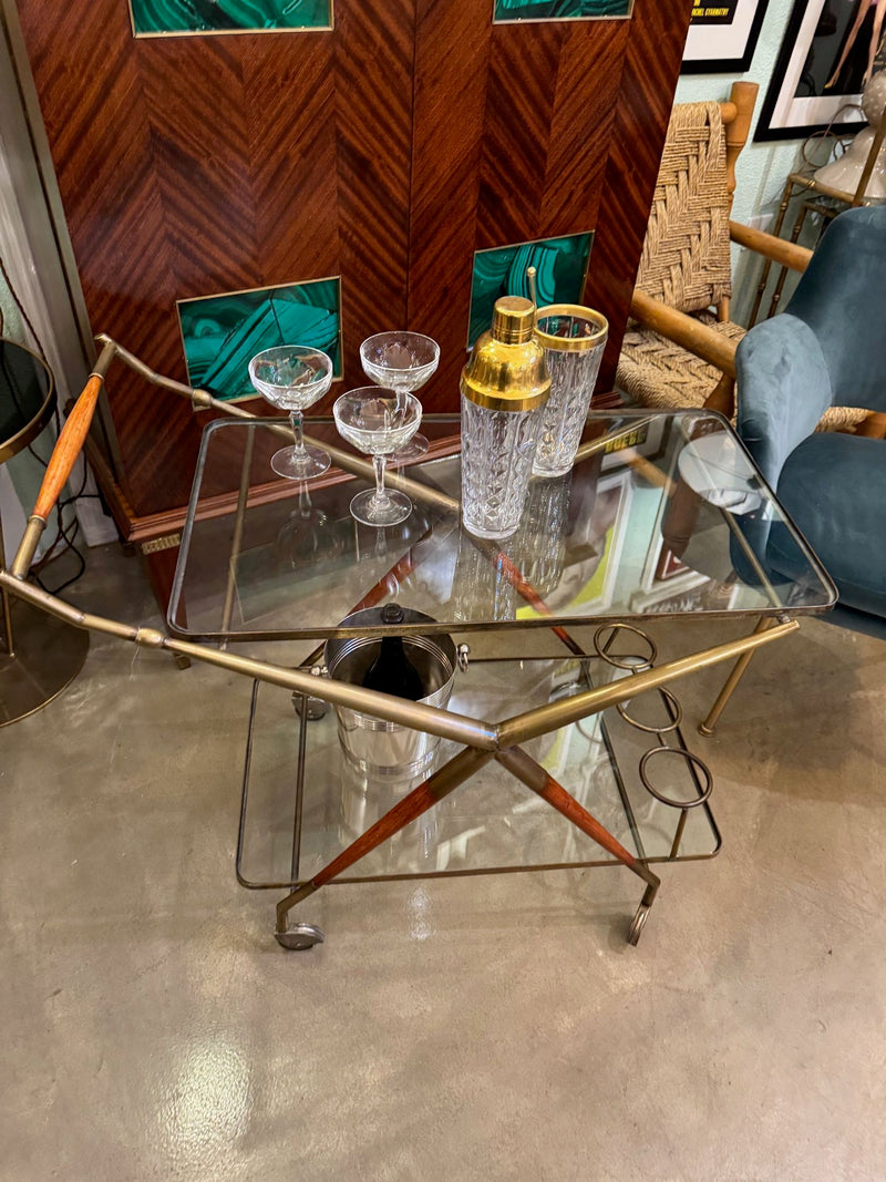 An Italian 1950s brass and lacquered wood bar trolley by Cesare Lacca