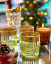 A set of six Italian Artemisia green crystal tumblers with 24 ct gold decoration