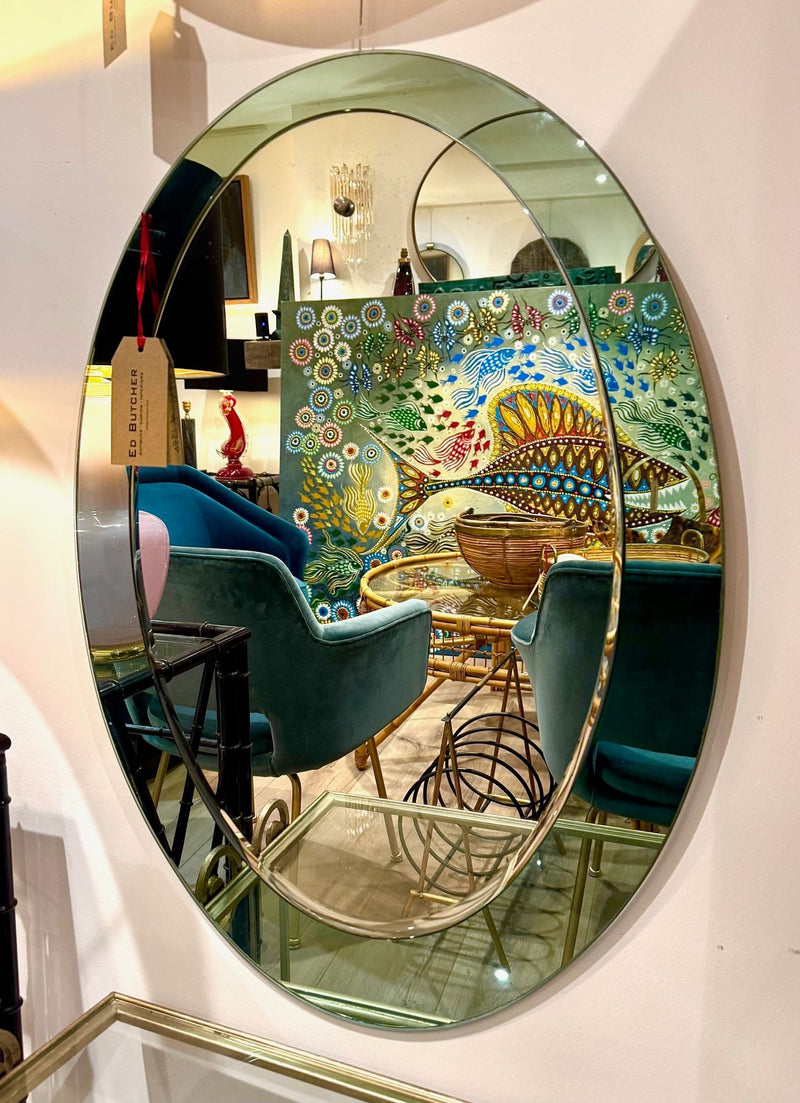 An Italian 1960s Crystal Arte oval mirror with pastel mint green mirrored frame