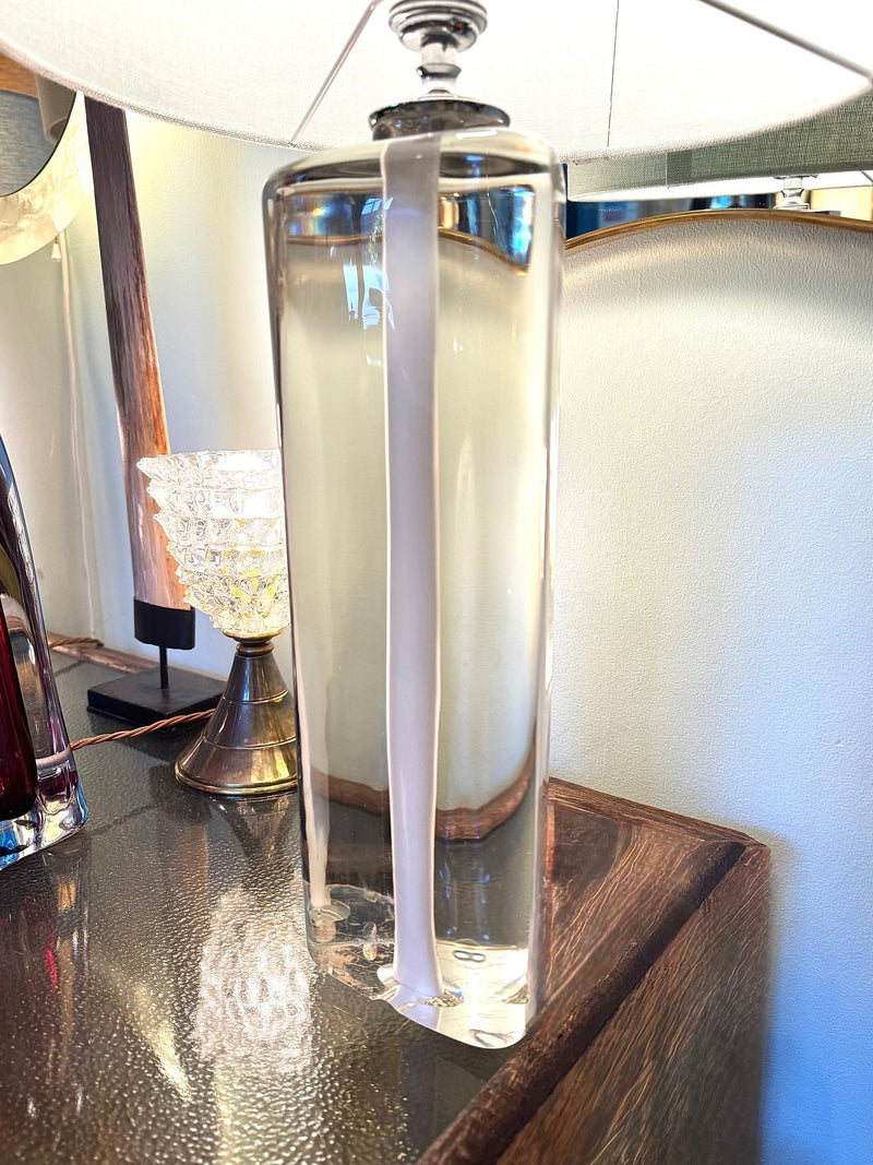 A pair of 1960s Orrefors heavy glass lamps with white glass core and nickel fittings