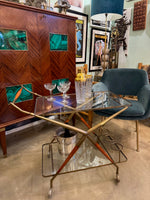 An Italian 1950s brass and lacquered wood bar trolley by Cesare Lacca