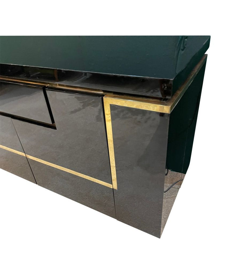 A 1970s vintage black piano lacquer sideboard by Jean Claude Mahey for Roche Bobois with brass detail