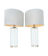 A pair of 1960s Orrefors heavy glass lamps with white glass core and nickel fittings