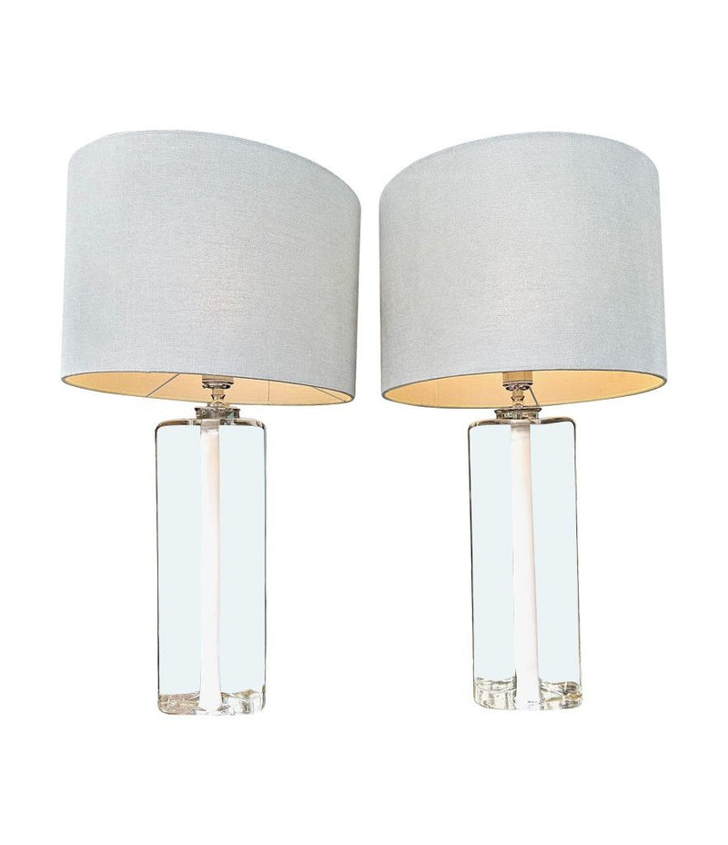 A pair of 1960s Orrefors heavy glass lamps with white glass core and nickel fittings