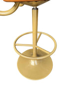 A set of four Börje Johanson “Jupiter” bar stools in cognac faux leather