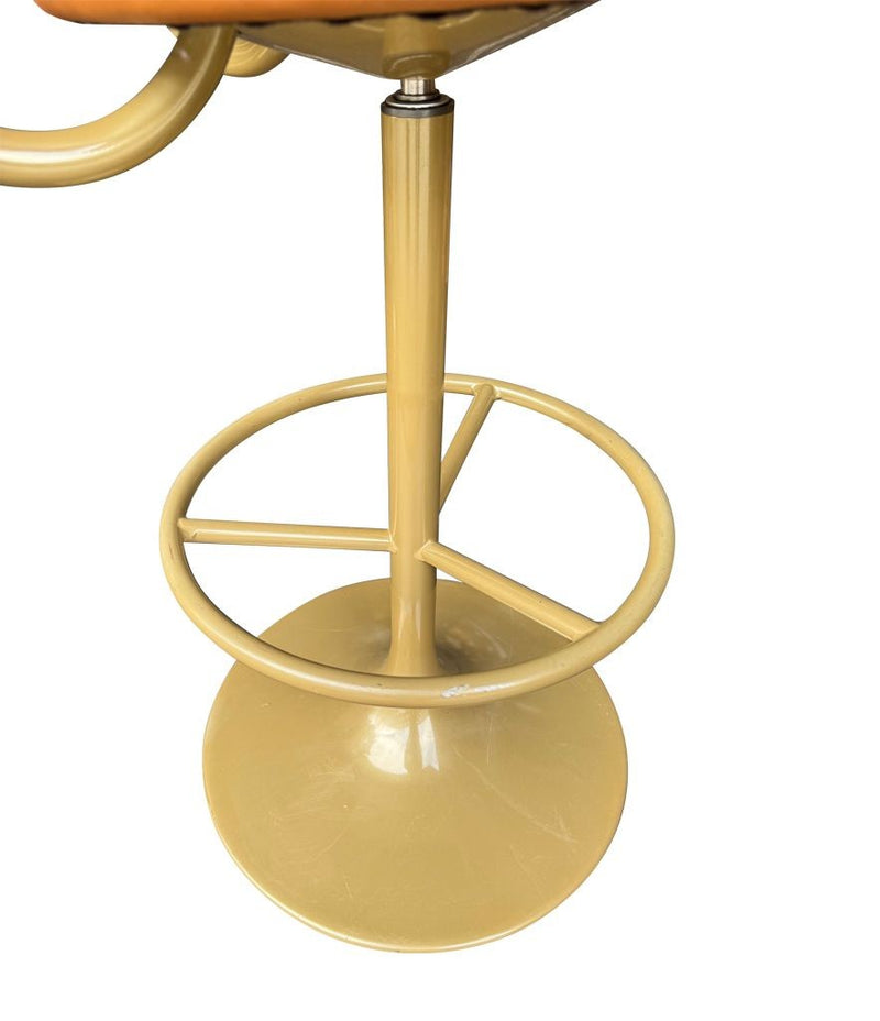 A set of four Börje Johanson “Jupiter” bar stools in cognac faux leather