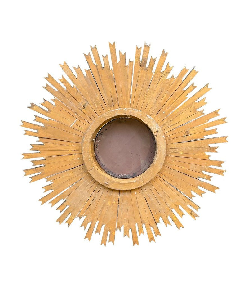 A large 1940s French carved wood gilt sunburst mirror