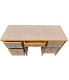 A 1980s colonial style carved wood and rattan desk by Roche Bobois