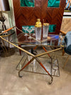 An Italian 1950s brass and lacquered wood bar trolley by Cesare Lacca