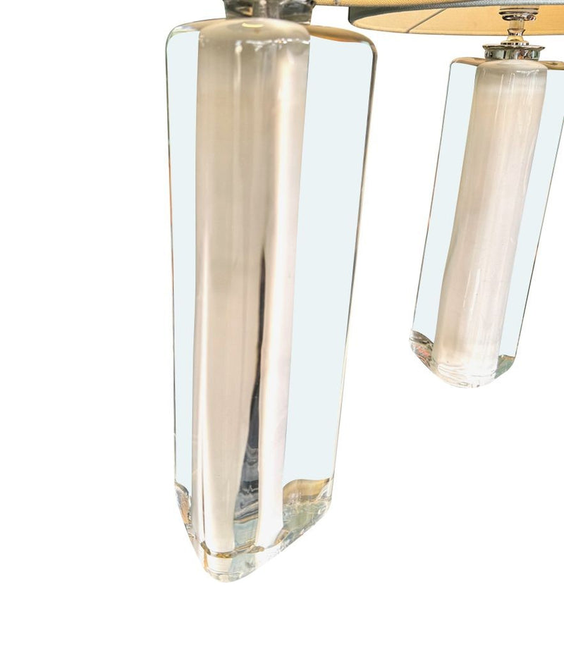 A pair of 1960s Orrefors heavy glass lamps with white glass core and nickel fittings