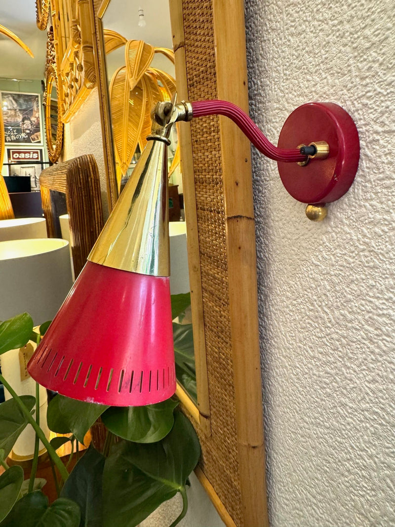 A pair of Holm Sorensen 1950s red enamelled metal and brass adjustable wall lights