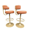 A set of four Börje Johanson “Jupiter” bar stools in cognac faux leather