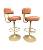 A set of four Börje Johanson “Jupiter” bar stools in cognac faux leather