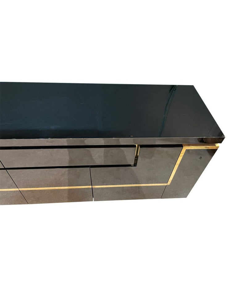 A 1970s vintage black piano lacquer sideboard by Jean Claude Mahey for Roche Bobois with brass detail