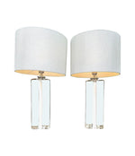 A pair of 1960s Orrefors heavy glass lamps with white glass core and nickel fittings