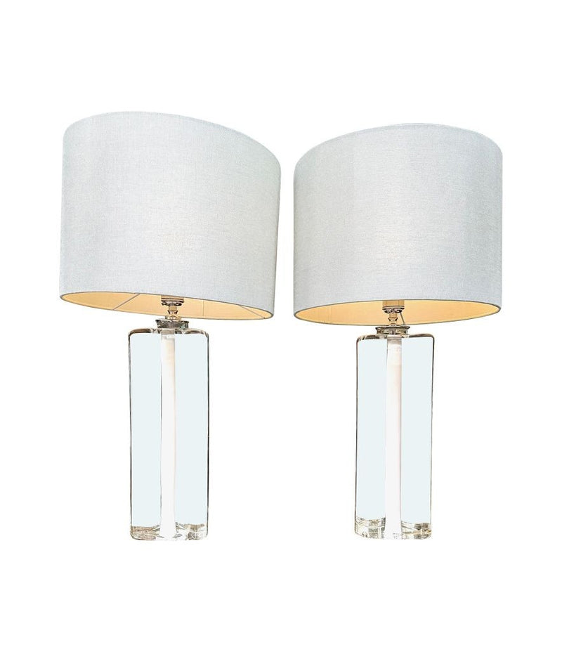 A pair of 1960s Orrefors heavy glass lamps with white glass core and nickel fittings