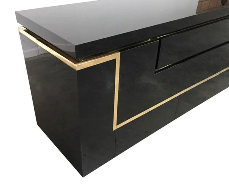 A 1970s vintage black piano lacquer sideboard by Jean Claude Mahey for Roche Bobois with brass detail