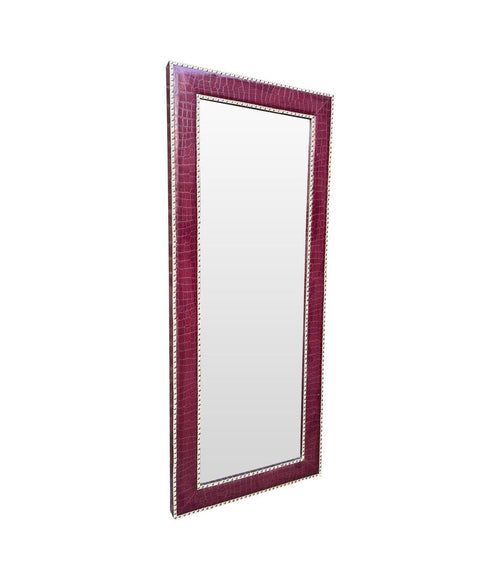 A large contemporary full length mirror with burgundy faux crocodile skin frame.