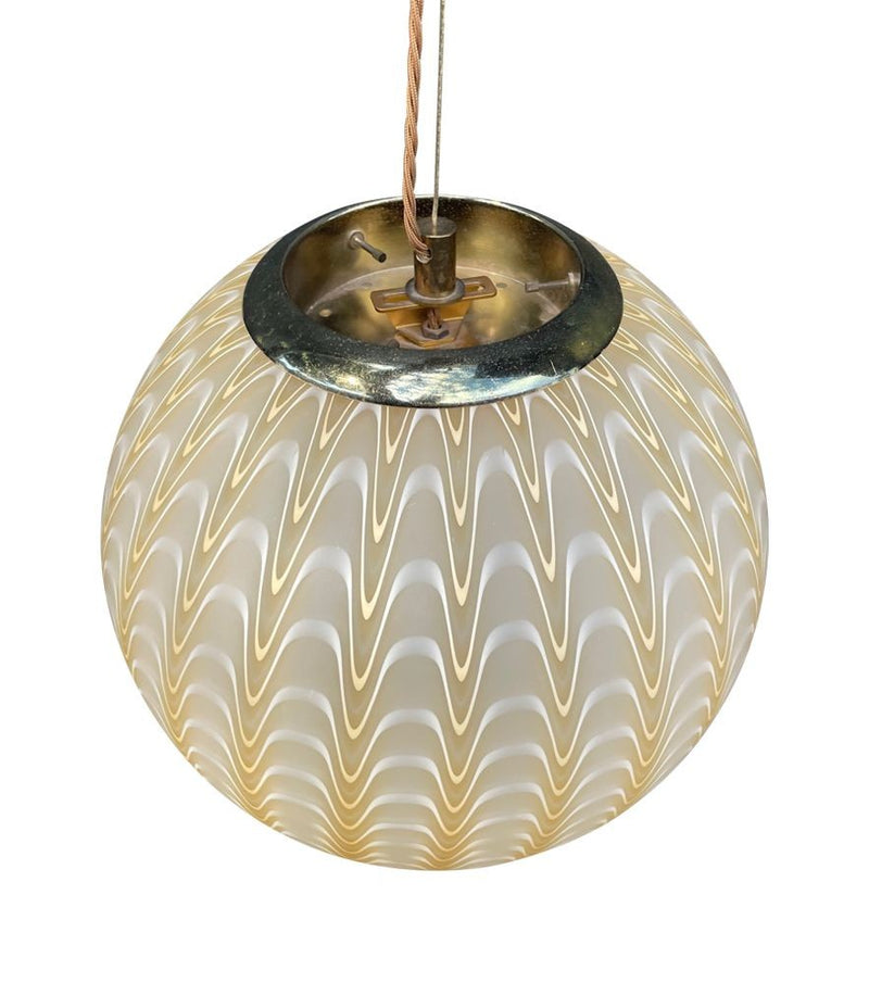 A 1960s Murano glass pendant light attributed to Venini with yellow and white swirl patten