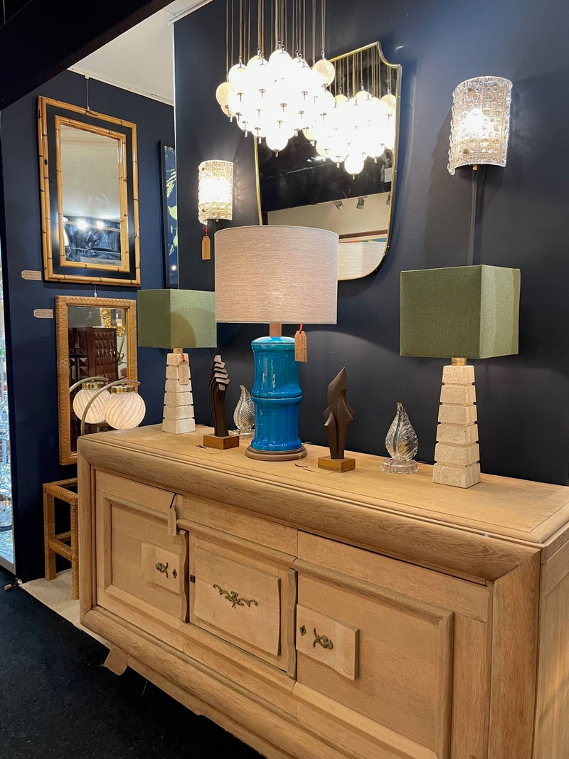 Mid Century table lamps with Travertine bases and brass fittings with blue linen shades