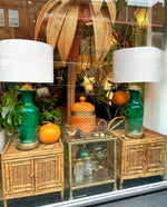 A pair of Italian 1970s Vivai Del Sud style tortoiseshell bamboo bedside tables with two doors