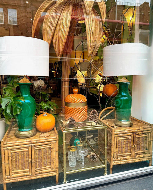 A pair of Italian 1970s Vivai Del Sud style tortoiseshell bamboo bedside tables with two doors