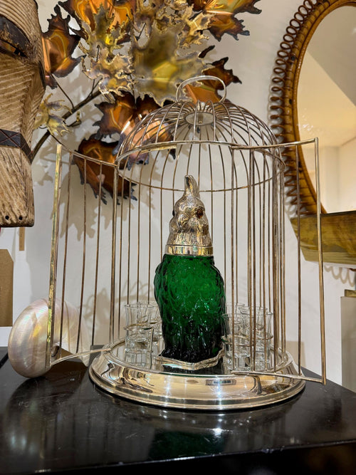 A wonderful Victorian style green glass, cockatoo decanter in silver plated cage with 8 glasses