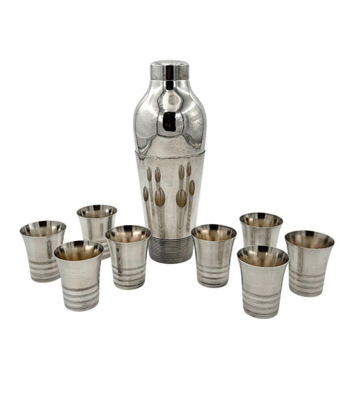 A 1930s Silver plated Art deco cocktail set with silver plated cocktail shaker and eight silver plated shot glasses