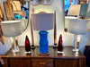 A pair of 1960s Orrefors heavy glass lamps with white glass core and nickel fittings