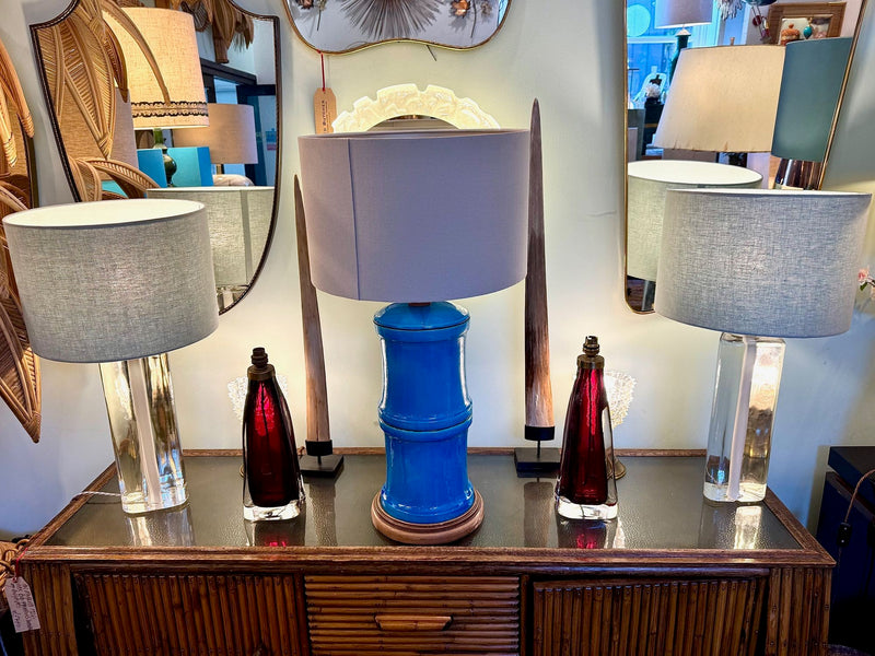 A pair of 1960s Orrefors heavy glass lamps with white glass core and nickel fittings