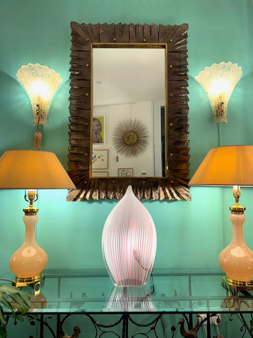 A stunning Italian bronze Murano glass frammed mirror with brass inner frame