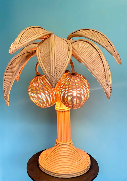 A bamboo palm tree table lamp in the style of Mario Lopez Torres with two lights