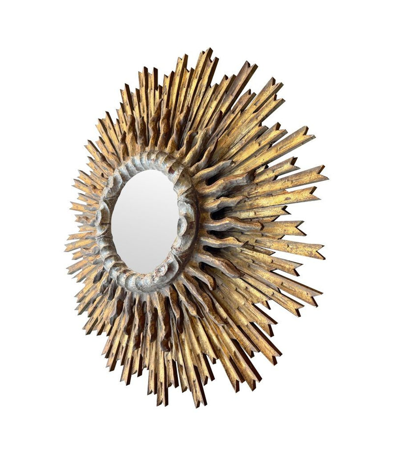 A large 1940s French carved wood gilt sunburst mirror