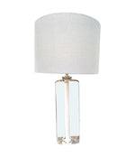A pair of 1960s Orrefors heavy glass lamps with white glass core and nickel fittings