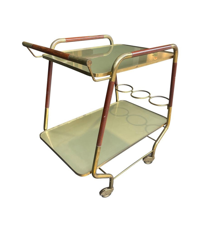 Vintage drinks trolley by Cesare Lacca, gold and lacquered wood with gold painted glass shelves, brass bottle holder and original brass castors. Italian Circa 1950s 