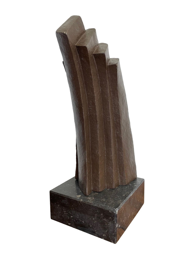 A Mid Century Belgian ceramic abstract sculpture with bronze textured style finish mounted on black marble base
